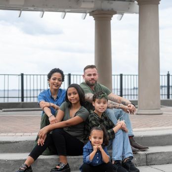 Jessica Life Photography - Family sitting on steps in front of the St. John's River at Stockton Park in Jacksonville, FL - Session Photography Near Me Jessica Life Photography - Family sitting on steps in front of the St. John's River at Stockton Park in Jacksonville, FL - Session Photography Near Me