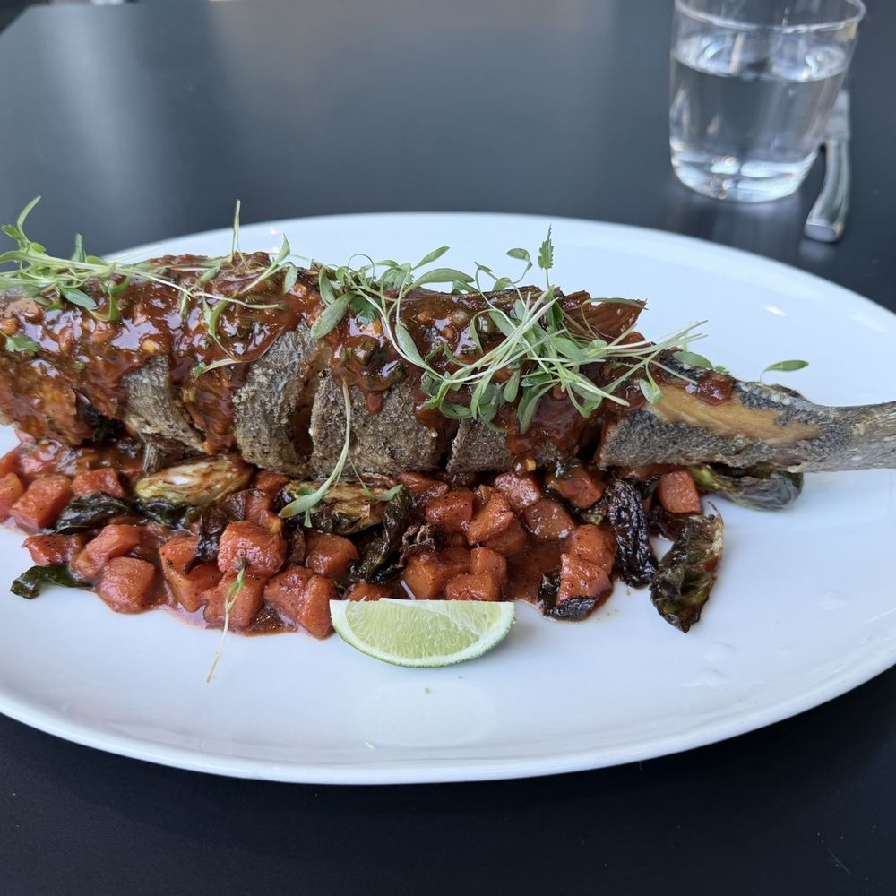 Bocanova - Grilled Branzino with Brussels sprouts. - Latin American Near Me - Oakland, California Bocanova - Grilled Branzino with Brussels sprouts. - Latin American Near Me - Oakland, California