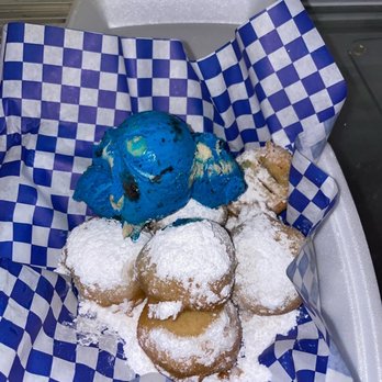 18 Street Raspas - a tray of powdered sugar donuts with a blue ice cream on top - Ice Cream & Frozen Yogurt Near Me - Hondo, Texas 18 Street Raspas - a tray of powdered sugar donuts with a blue ice cream on top - Ice Cream & Frozen Yogurt Near Me - Hondo, Texas