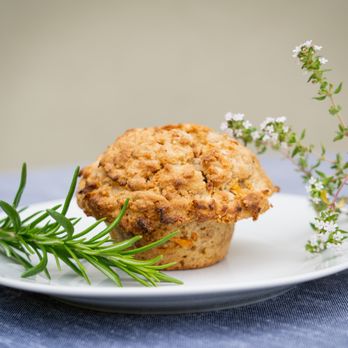 Deeply Nourished - a muffin on a plate with a sprig of rosemary - Personal Chefs Near Me - La Jolla, California