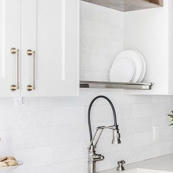 Martone Home Improvements - a kitchen with white cabinets - General Contractors Near Me Martone Home Improvements - a kitchen with white cabinets - General Contractors Near Me