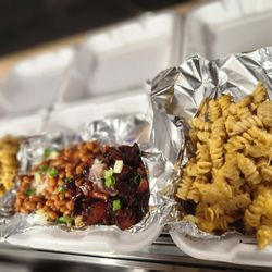 The Loaded Baked Potato Bar - Burnt ends potato, brisket mac and cheese potato.