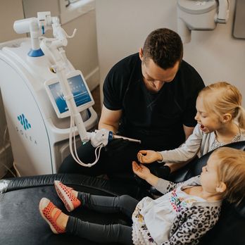 Kelowna Dental Centre - Dr. Michal Webster in lighter moments with pediatric patients at Kelowna Dental Centre - General Dentistry Near Me - Kelowna, British Columbia Kelowna Dental Centre - Dr. Michal Webster in lighter moments with pediatric patients at Kelowna Dental Centre - General Dentistry Near Me - Kelowna, British Columbia