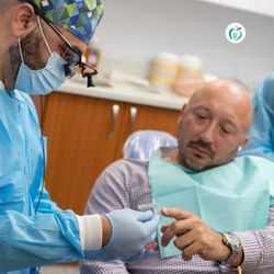 Atlas Park Dental - Orthodontist consulting with a patient about an Invisalign treatment plan at Atlas Park Dental in Glendale, NY.