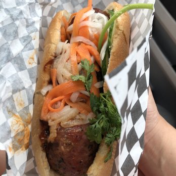 B's Banh Mi - a hand holding a sandwich - Vietnamese Near Me - Oakville, Ontario B's Banh Mi - a hand holding a sandwich - Vietnamese Near Me - Oakville, Ontario