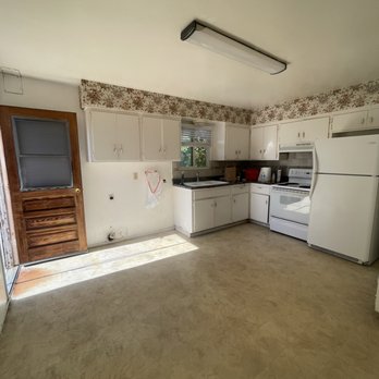 Mesi Construction - a kitchen with white cabinets and appliances - General Contractors Near Me Mesi Construction - a kitchen with white cabinets and appliances - General Contractors Near Me