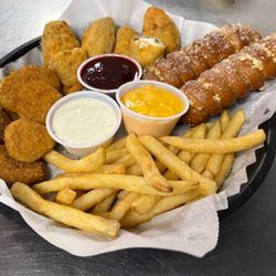Escapades Family Fun Center - Appetizer sampler with fried pickles, jalapeno poppers, Bavarian soft pretzels, & french fries