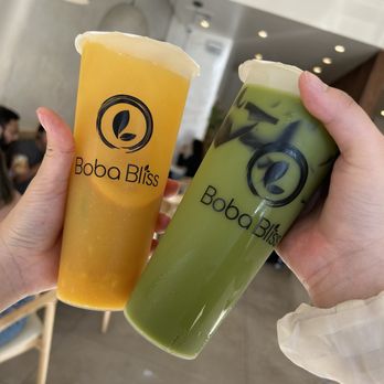 Boba Bliss - Left: Summer Mango Green Tea Right: Thai Green Tea with Oat Milk Substitution and Grass Jelly - Bubble Tea Near Me - Castro Valley, California Boba Bliss - Left: Summer Mango Green Tea Right: Thai Green Tea with Oat Milk Substitution and Grass Jelly - Bubble Tea Near Me - Castro Valley, California