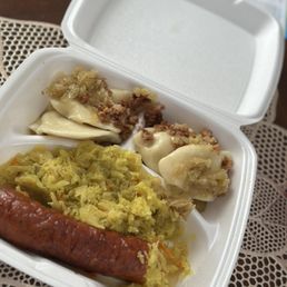 Boiled Potato & Cheese Pierogi toped with bacon bits and caramelized onion, Kielbasa & Sauerkraut