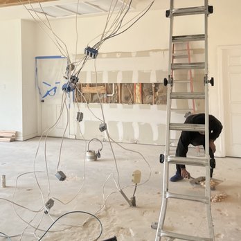 Home Pixel - a man on a ladder in a room that is being remodeled - General Contractors Near Me Home Pixel - a man on a ladder in a room that is being remodeled - General Contractors Near Me