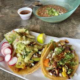 Veggie tacos with offerings from the salsa bar along with pinto beans Veggie tacos with offerings from the salsa bar along with pinto beans
