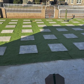 Moises Hilario Trujillo Landscaping - a green lawn with squares and a stop sign - Landscaping Near Me