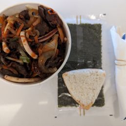 Beef bulgogi cup bap with squid added and a tuna triangle kimbab before wrapped in the seaweed.