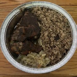 Happy Feet Caribbean Cuisine - Jerk Chicken with rice and peas and steamed cabbage