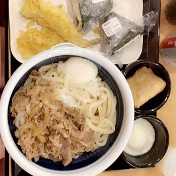 Marugame Udon - #9 Nikutama Udon (hot) with a side of freshly made Shrimp Tempura, Kitsune Age, Hot Spring Egg, and two varieties of rice ball (musubi). - Japanese Near Me - Costa Mesa, California