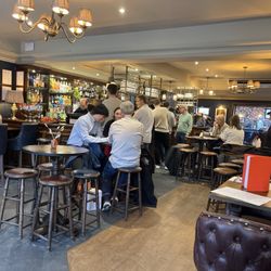 The bar is busy with local families, and the staff is friendly to tourists.