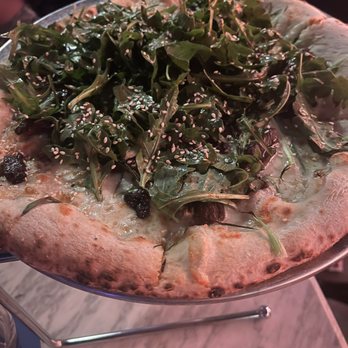 Netflix Bites - PIZZA BBQ SHORT RIBS, MOZZARELLA, ARUGULA, CHILI VINAIGRETTE - American Near Me - Los Angeles, California