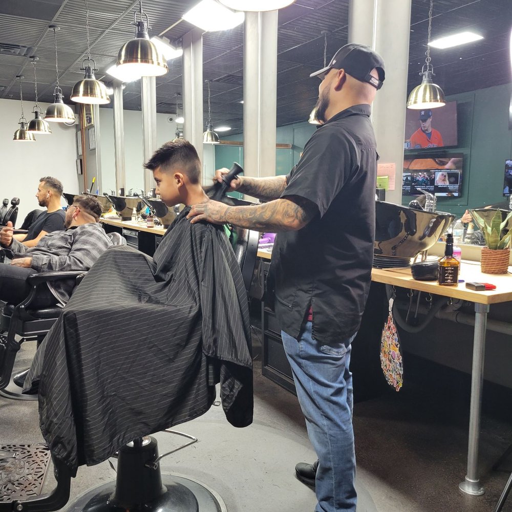 Alex working his magic on my boy. Alex working his magic on my boy.