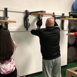 Flip Body Fit - Family learning the speedbag