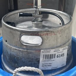 a keg in a blue bucket a keg in a blue bucket