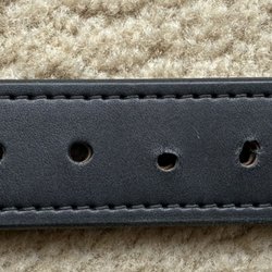 John's Shoe Repair - Poorly punched holes on Filson bridle leather belt -- uneven and misaligned.