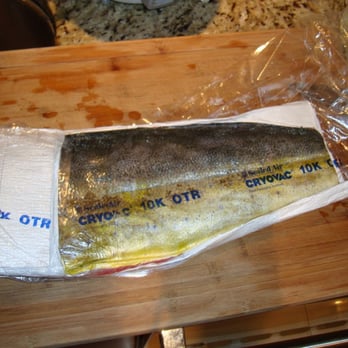 Honolulu Fish Company - a fish wrapped in plastic on a cutting board - Seafood Markets Near Me - Honolulu, Hawaii Honolulu Fish Company - a fish wrapped in plastic on a cutting board - Seafood Markets Near Me - Honolulu, Hawaii