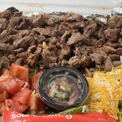 Main Street Tacos - Big bowl   Lettuce cheese tomatoes rice beans corn steak on top