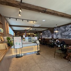 View when you walk in, super spacious, lots of places to sit with outlets, kind of dark inside