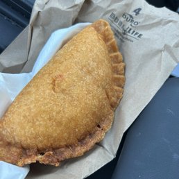 Chicken empanada filled with chicken wish there was some cheese inside, but can't complain