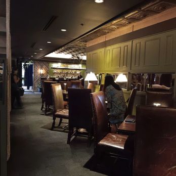 Vintage Books - Table and chairs - Speakeasies Near Me - Honolulu, Hawaii