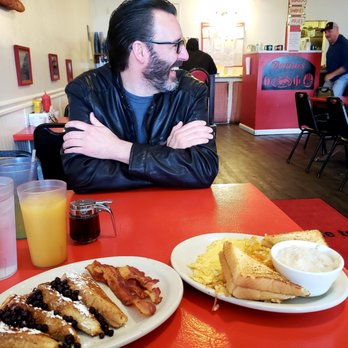 Deano's Diner - a man sitting at a table with breakfast - Diners Near Me - Ashley, Indiana