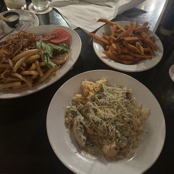 The Whiskey Kitchen - on the left, barbecue chicken sandwich. In front, smothered chicken entrée. On the side, sweet potato fries. - Gastropubs Near Me - Virginia Beach, Virginia The Whiskey Kitchen - on the left, barbecue chicken sandwich. In front, smothered chicken entrée. On the side, sweet potato fries. - Gastropubs Near Me - Virginia Beach, Virginia