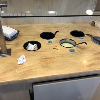 Pollo Tropical - Condiment bar - Latin American Near Me - West Melbourne, Florida