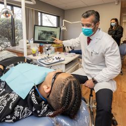 Central Orthodontic Associates - Dr. Ali Rad with a patient at Central Orthodontics