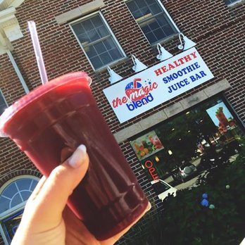 The Magic Blend - a hand holding a cup of juice - Juice Bars & Smoothies Near Me - Agawam, Massachusetts