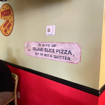 Island Slice Pizzeria - Fun signs hang as decor - Pizza Near Me - Mackinac Island, Michigan Island Slice Pizzeria - Fun signs hang as decor - Pizza Near Me - Mackinac Island, Michigan