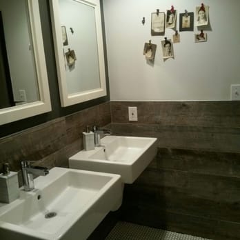 Iron Rooster - Old family photos add that homey feel in the ladies room - Cocktail Bars Near Me - Annapolis, Maryland