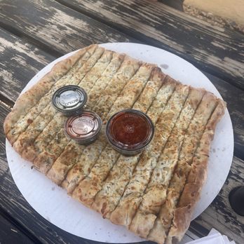 Bruno's Pizzeria - garlic sticks! we cleaned this plate in less than 5 minutes is was so good!! - Pizza Near Me - Santa Fe, New Mexico