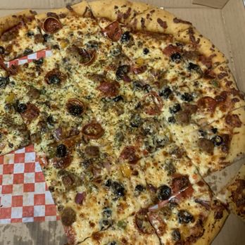 Brico’s Pizza Kitchen - This is a supreme. It is very, very good pizza, but seriously skimpy on toppings. - Pizza Near Me - San Marcos, Texas