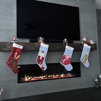 SE Denver Construction - a fireplace with stockings hung on it - General Contractors Near Me
