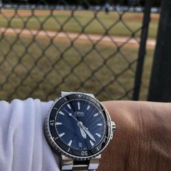 Throckmorton's - Oris Aquis Date
