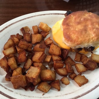 Sawmill Restaurant - Sausage link, egg and cheese biscuit with potatoes - American Near Me - Wilmington, North Carolina Sawmill Restaurant - Sausage link, egg and cheese biscuit with potatoes - American Near Me - Wilmington, North Carolina