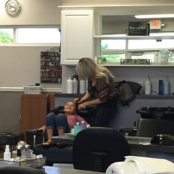 Hello Beautiful Salon - Getting her hair washed before cut... The smile says it all!