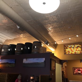 Rubaiyat - a view of a restaurant with a ceiling light - New American Near Me - Decorah, Iowa