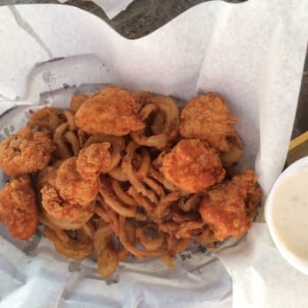Aqua Bar & Grill - Boneless wings on a bed of fries and onion straws. $11 - American Near Me - Afton, Oklahoma Aqua Bar & Grill - Boneless wings on a bed of fries and onion straws. $11 - American Near Me - Afton, Oklahoma
