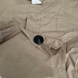 One of the shirts with the security tag still attached.