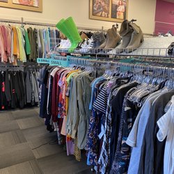Plato's Closet - Dress selection on the right and hoodies on the wall