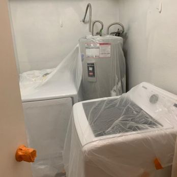 Titleist Home Improvement  - Those hooks on the wall were eventually patched/spackled/primed/painted on the final inspection. - Painters Near Me - Phoenix, Arizona