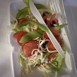 Napoli Pizza - This is their "antipasto salad". What a joke. Pizza sliced pepperoni, green peppers and some cheese over some Lettuce is far from it