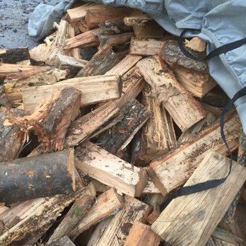 Green's Tree Service - a pile of chopped wood - Tree Services Near Me Green's Tree Service - a pile of chopped wood - Tree Services Near Me